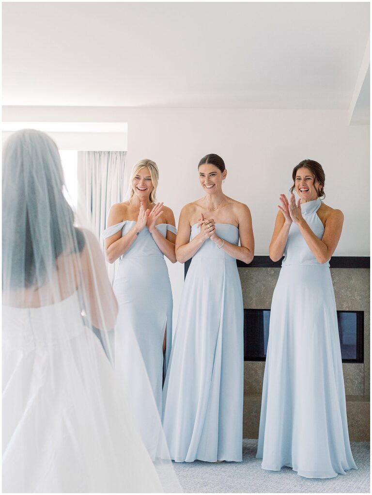 bride and bridesmaids first look