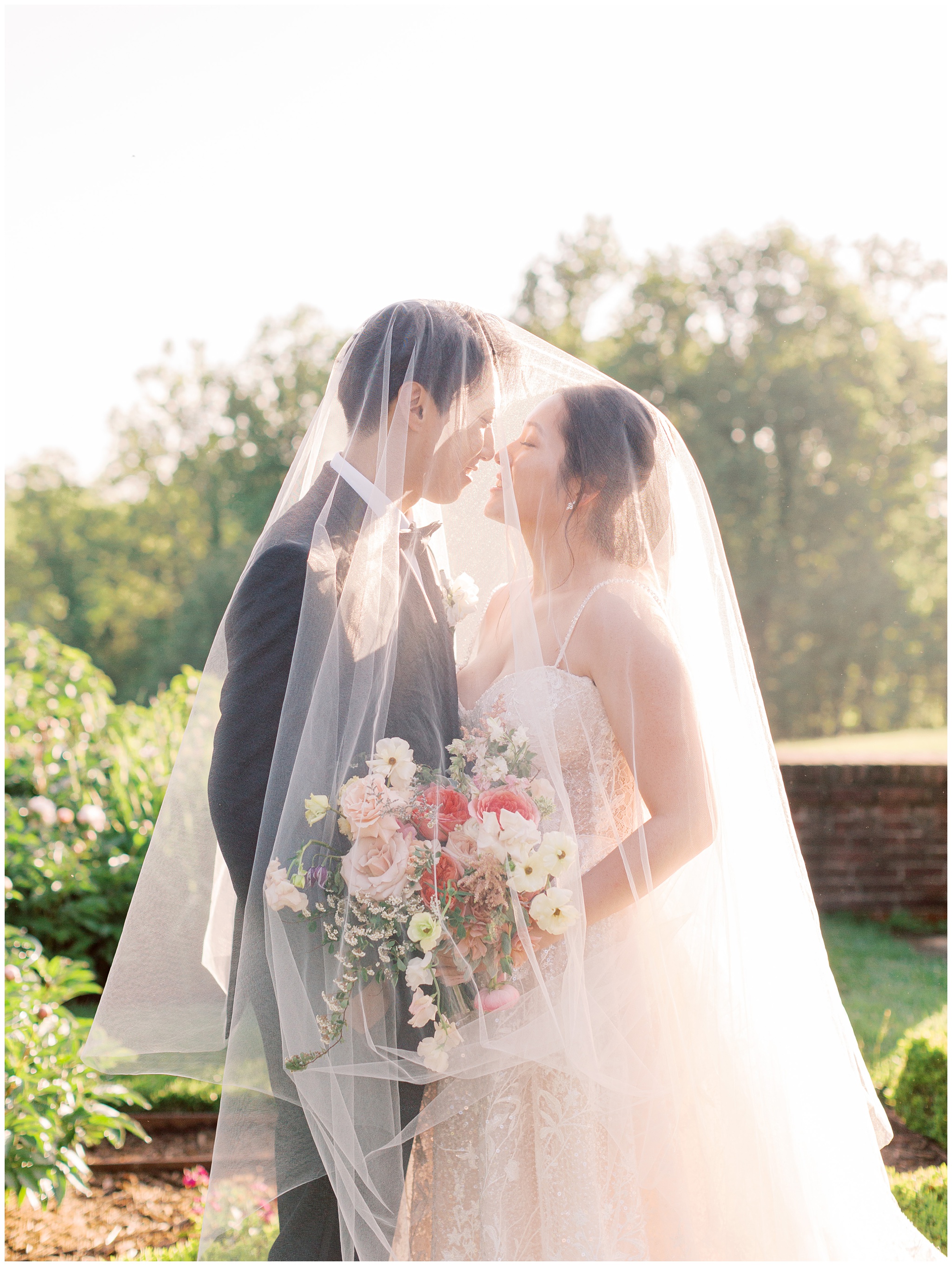 Bride and Groom Under the Veil Photo