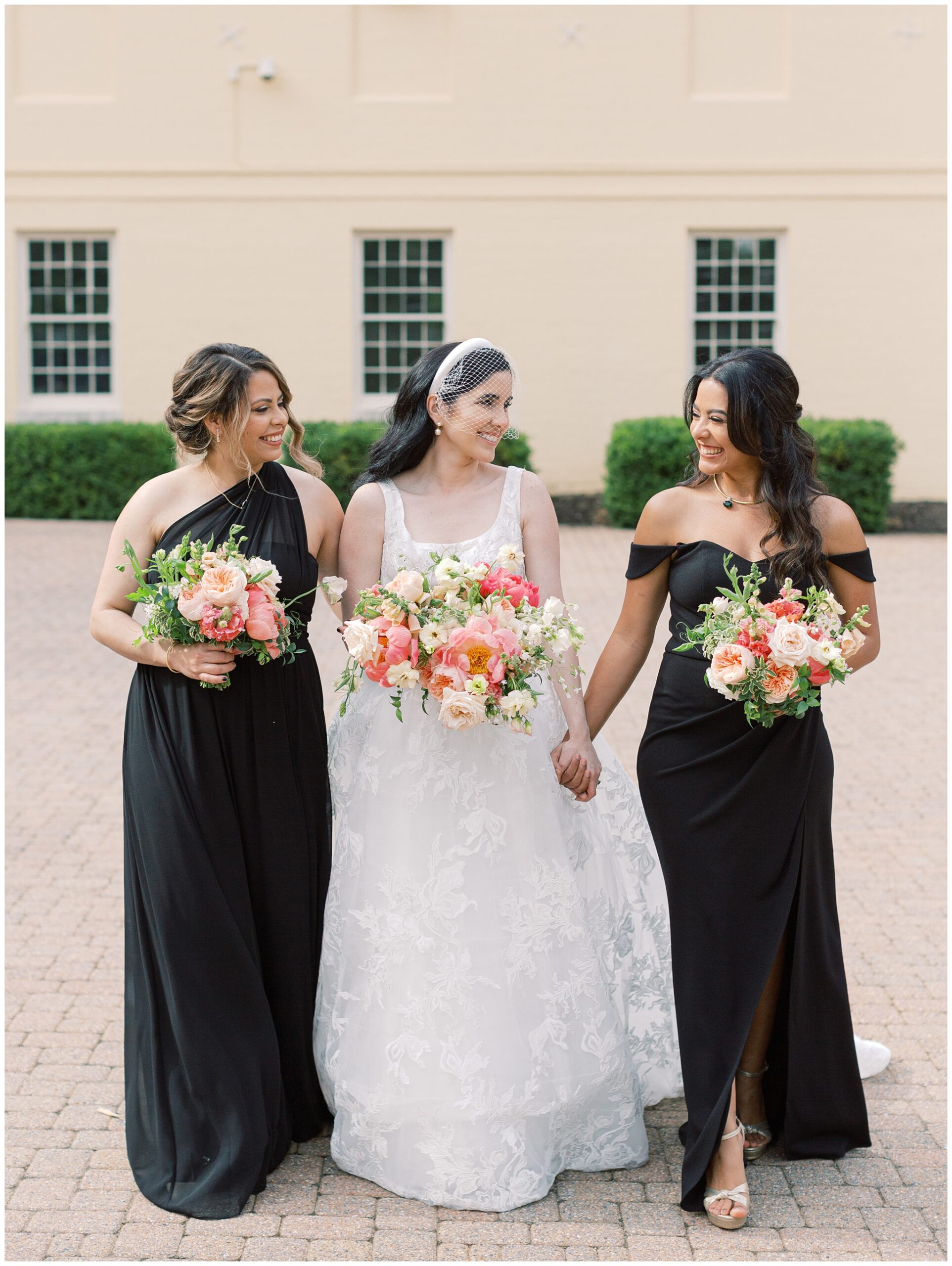 Wedding photo of bride and bridesmaids at Evergreen Museum in Baltimore