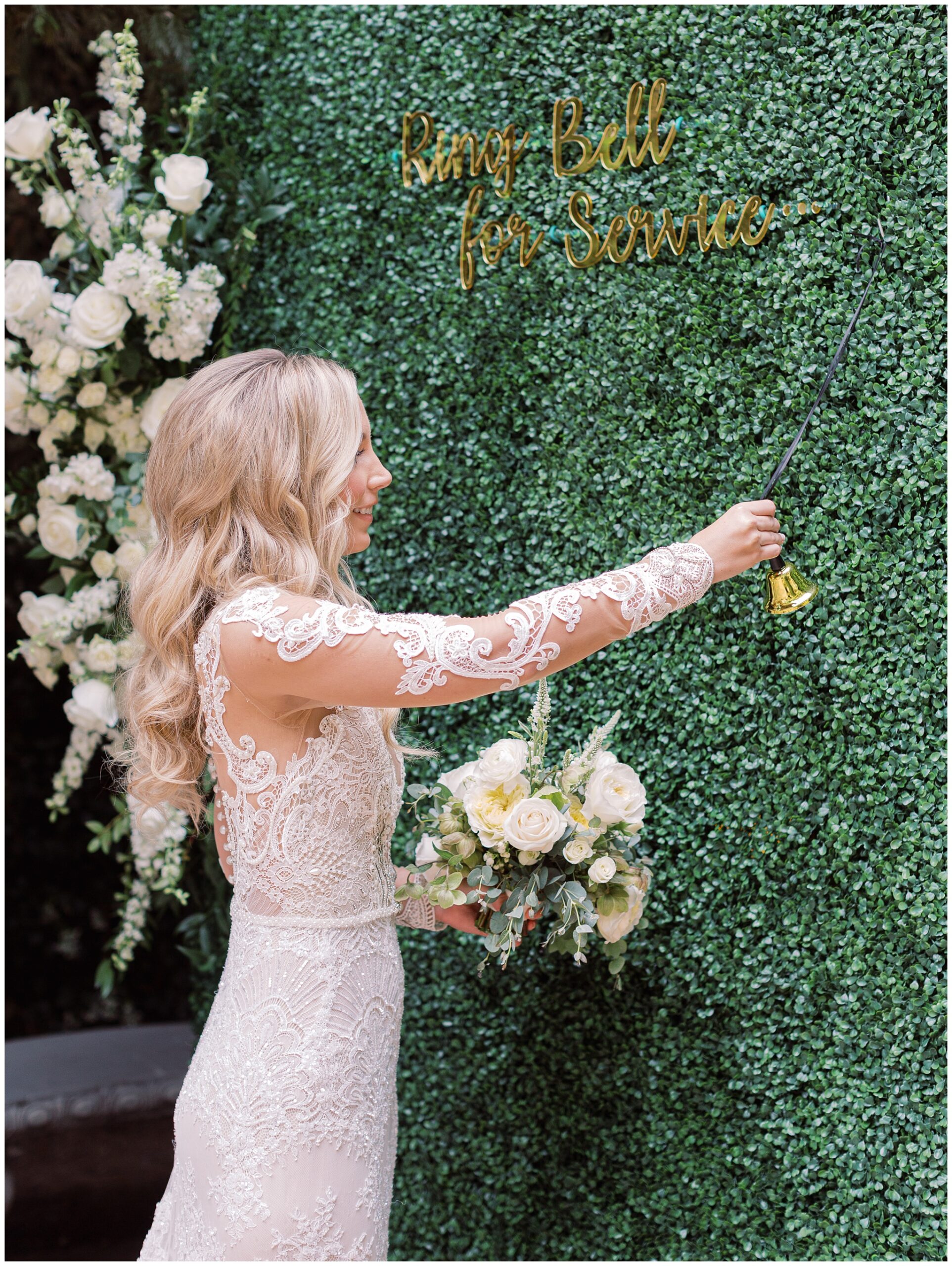 Bride ringing champagne wall bell