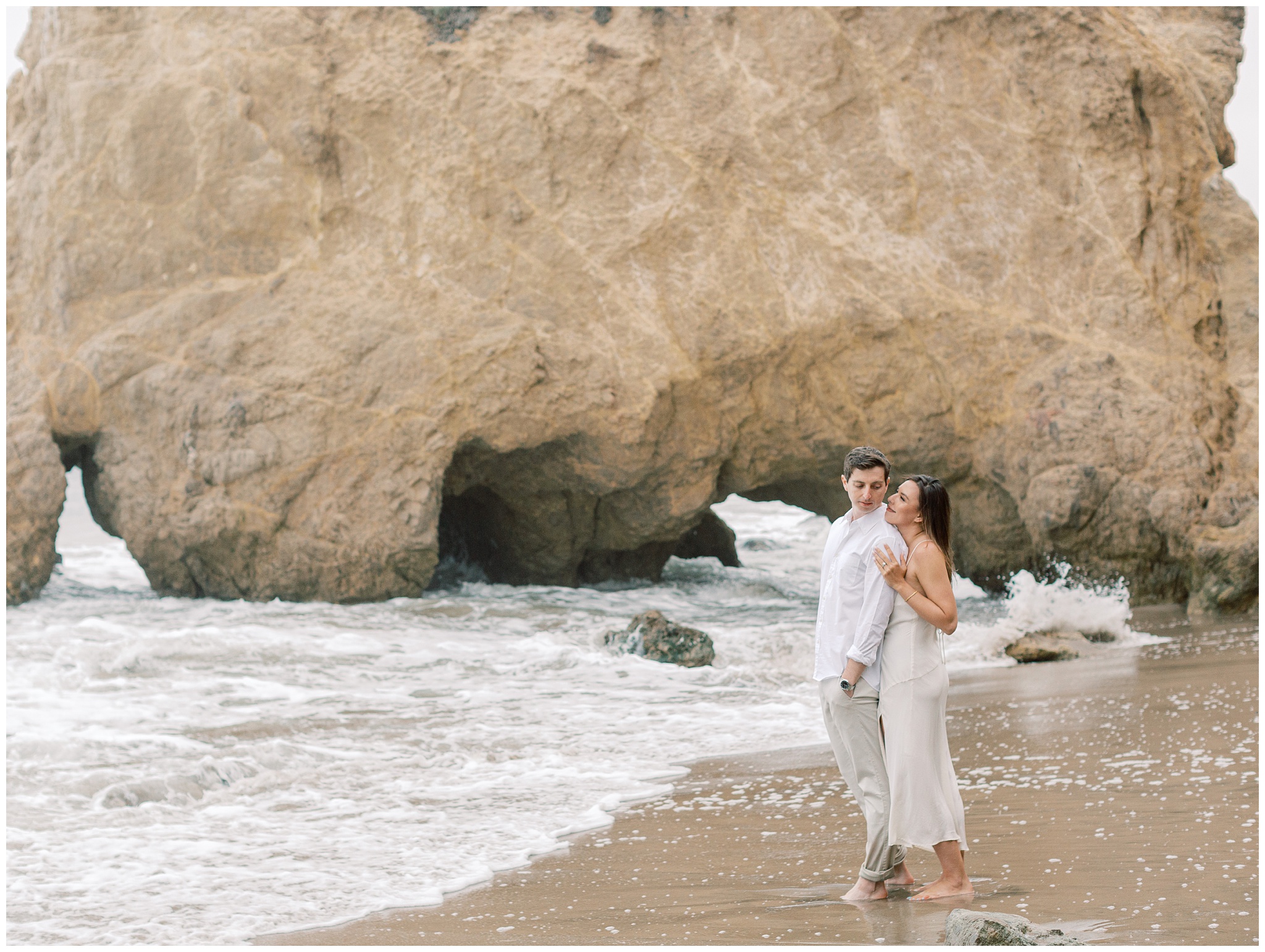El Matador Beach engagement photo on overcast day