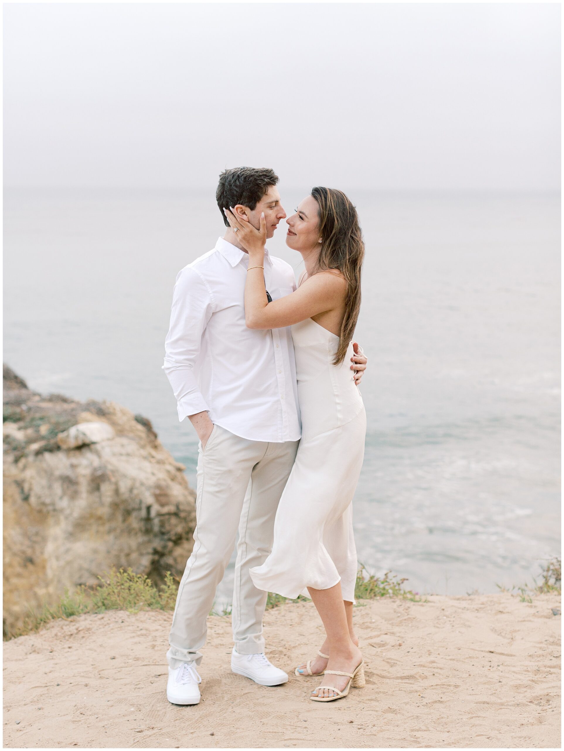 El Matador Beach engagement photo on overcast day
