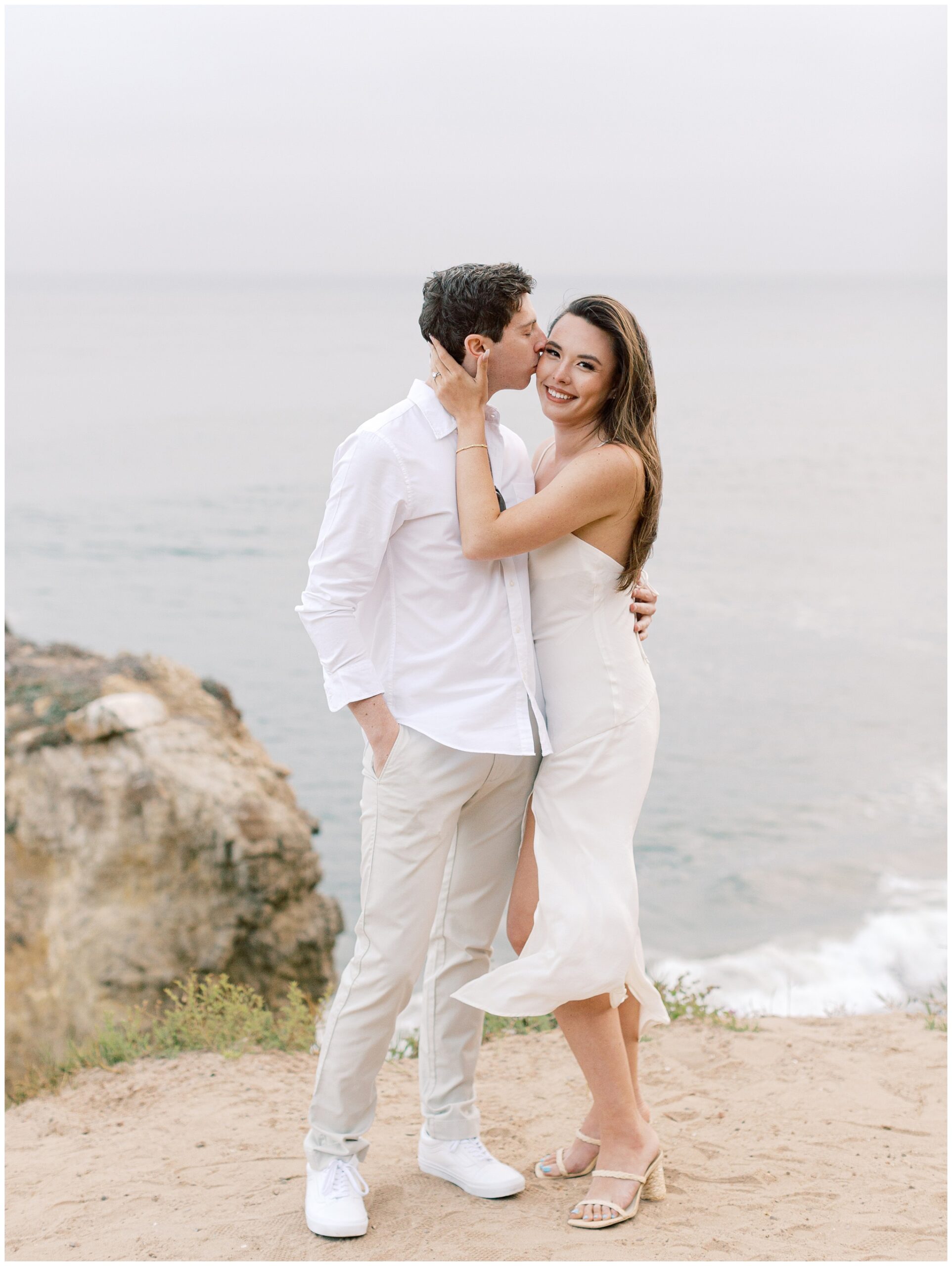 El Matador Beach engagement photo on overcast day