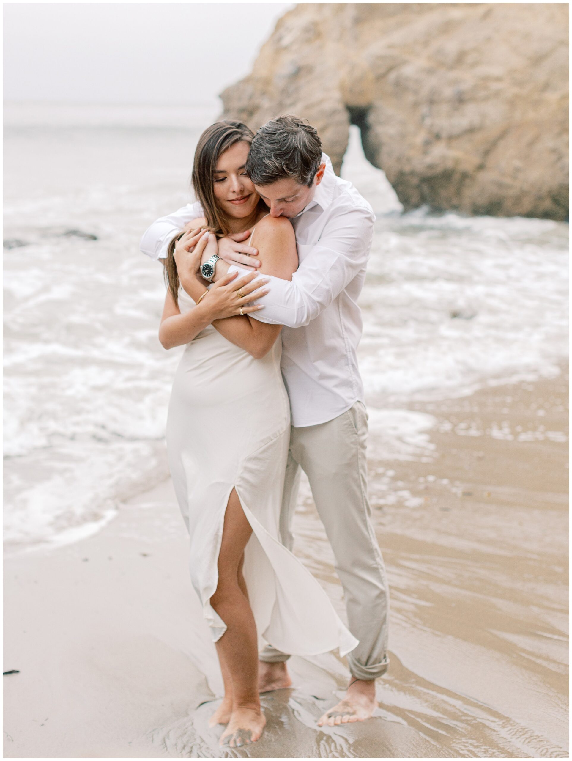 El Matador Beach engagement photo on overcast day