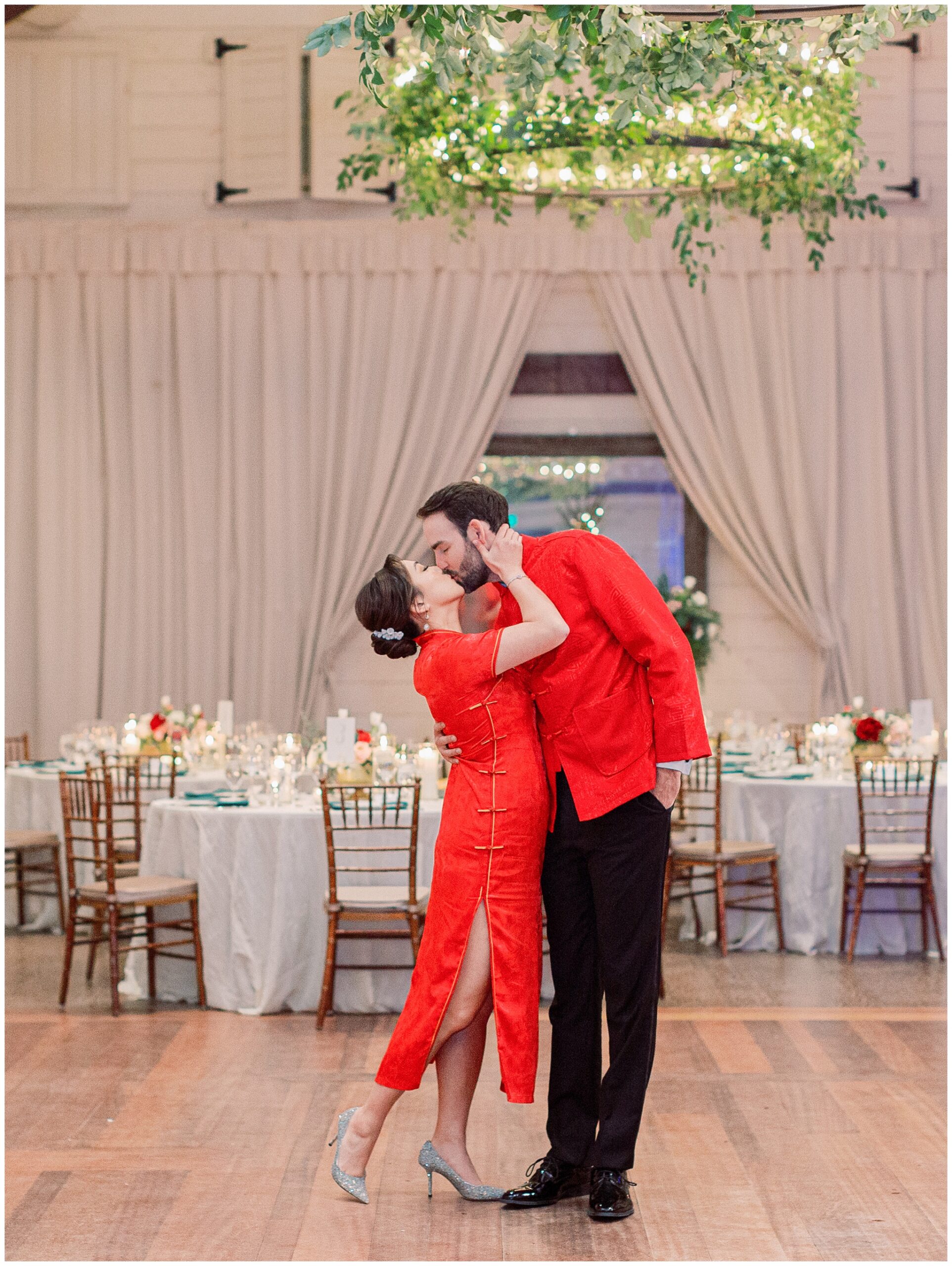 Bride and Groom kissing inside reception area