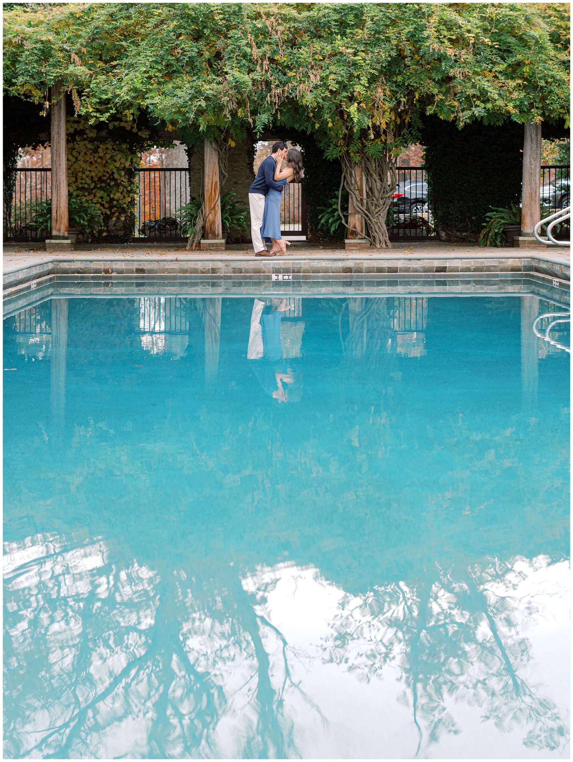 Goodstone Inn engagement photo kissing by pool