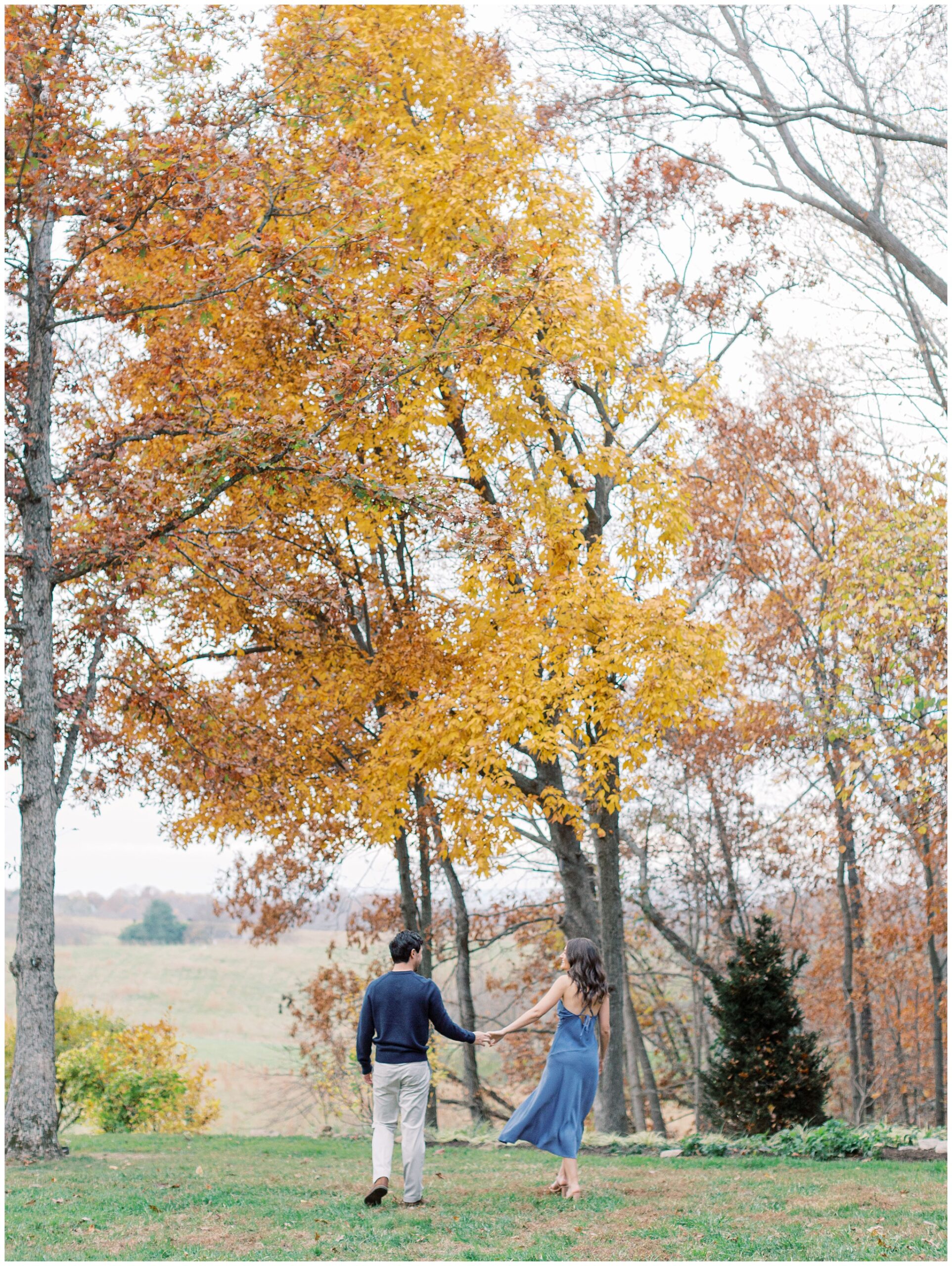 Goodstone Inn engagement photo walking with fall foliage