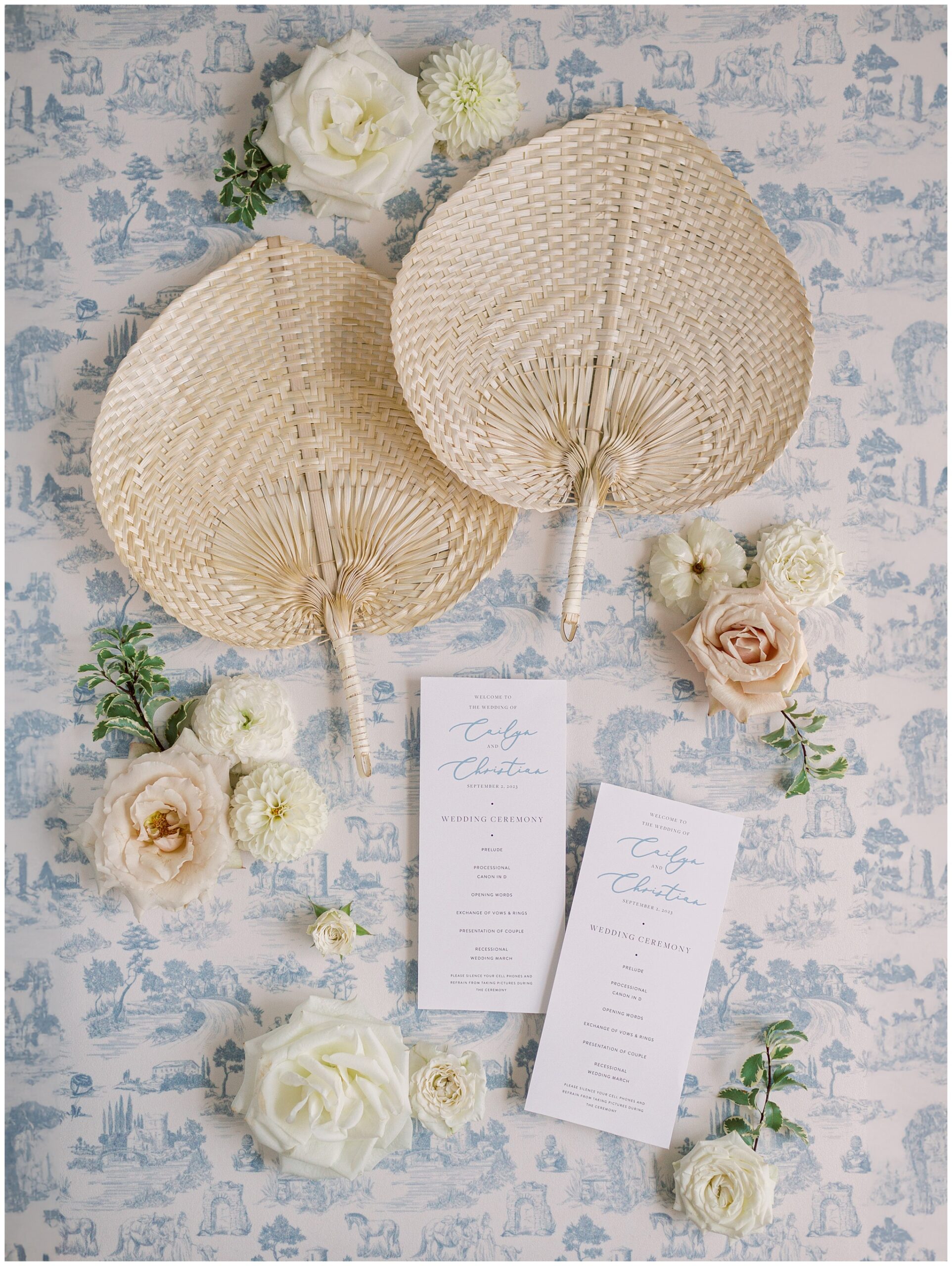 Ceremony program and fans flatlay