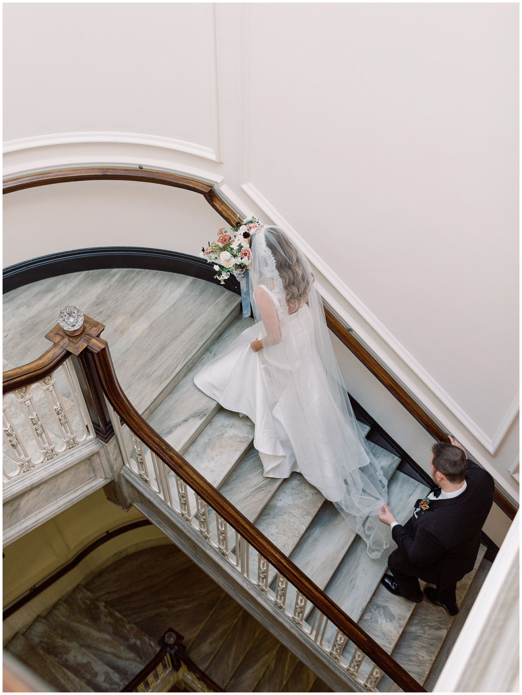 Bride and Groom walking up the staircase at DAR Constitution Hall wedding