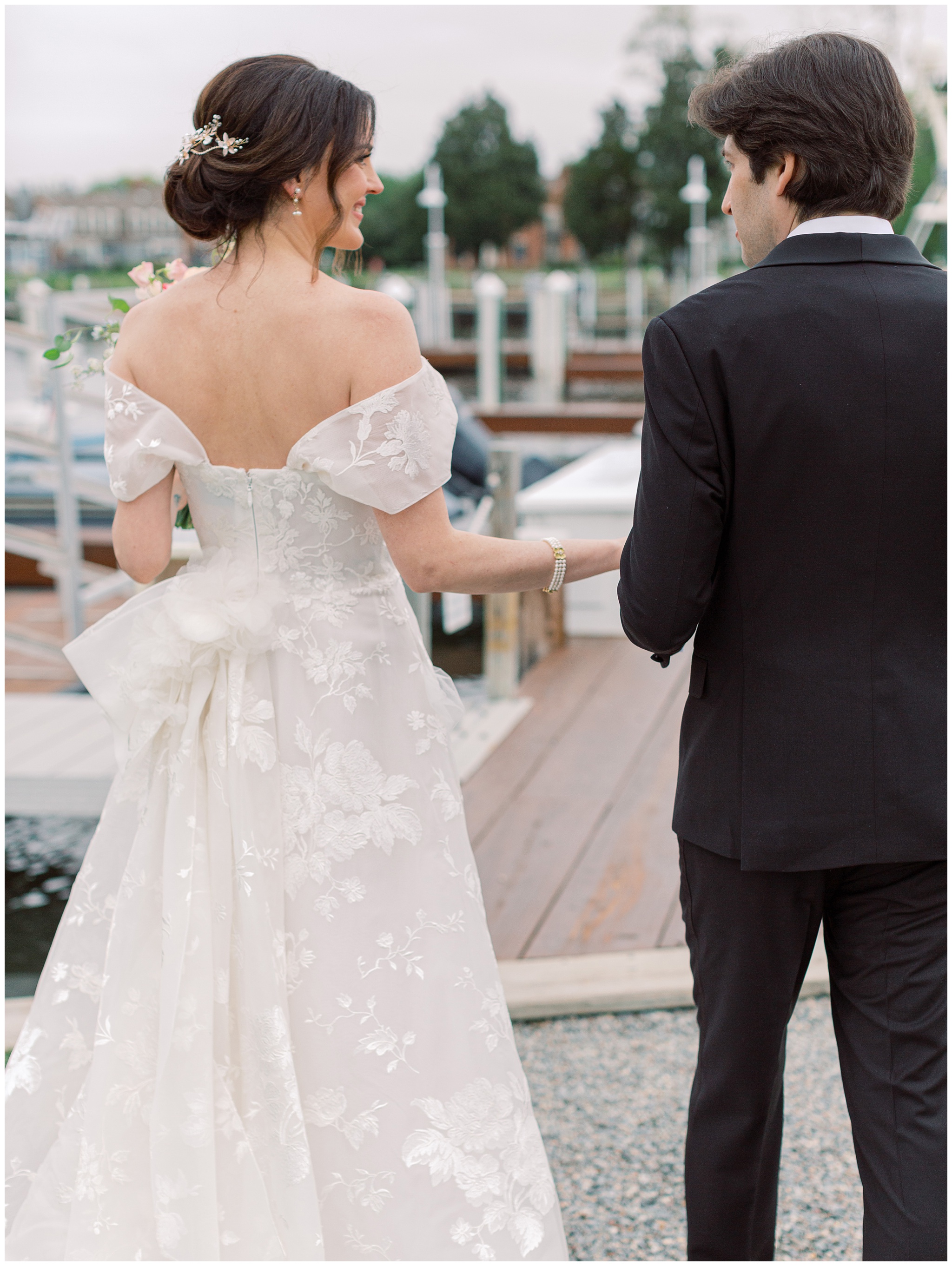 Bride and Groom walking in Marchesa dress