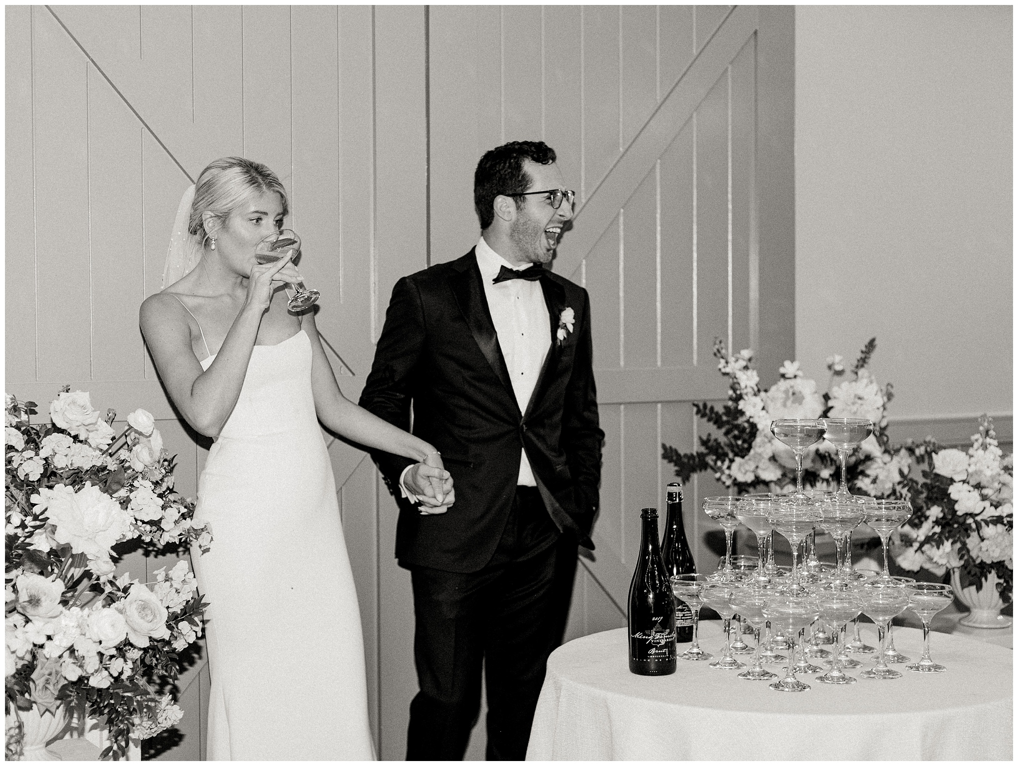Bride and Groom drinking champagne at King Family Vineyards reception