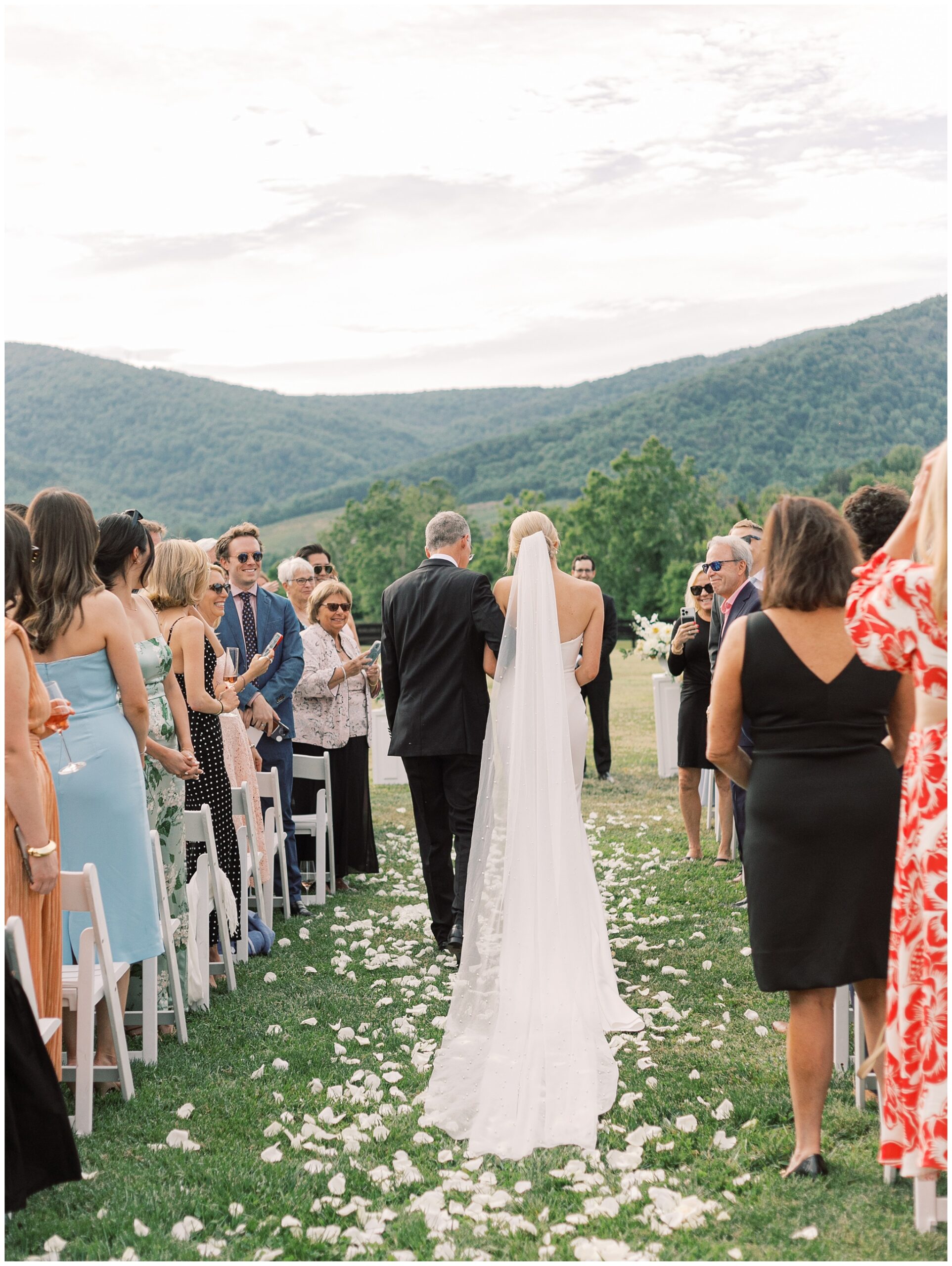 bride walking down the aisle with her dad
