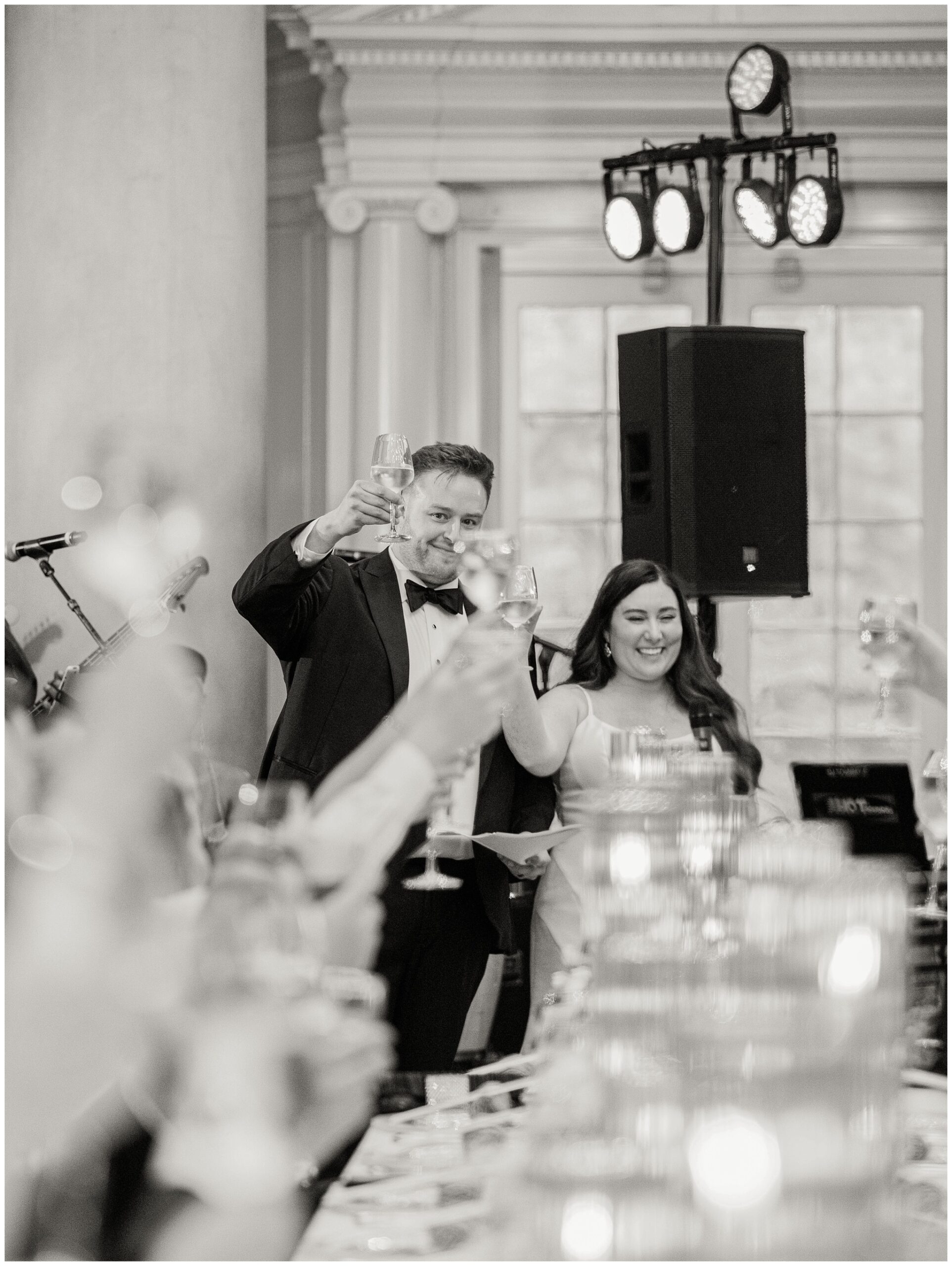 Bride and Groom black and white cheersing photo