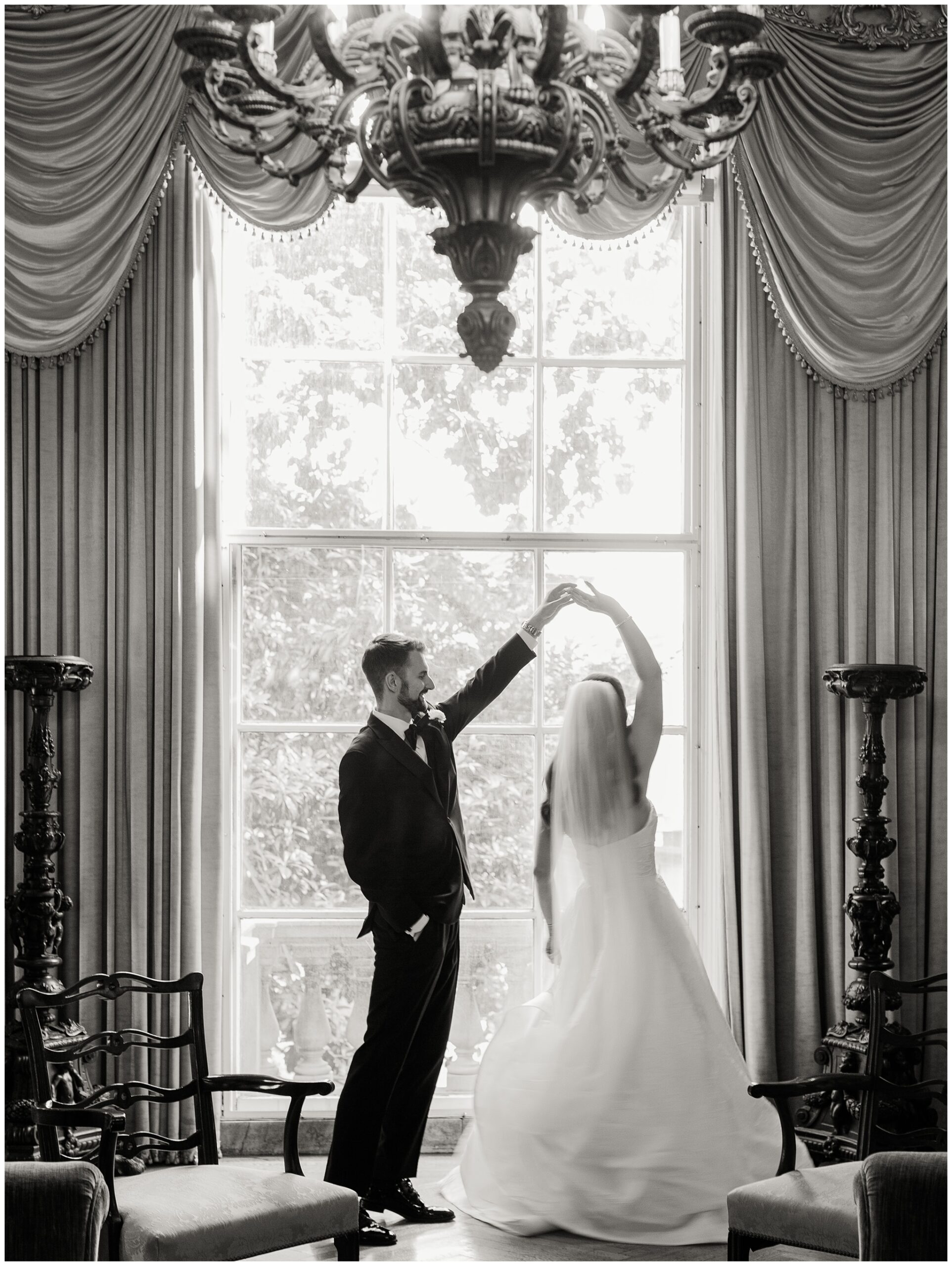 Groom spinning Bride in Anderson House parlor 