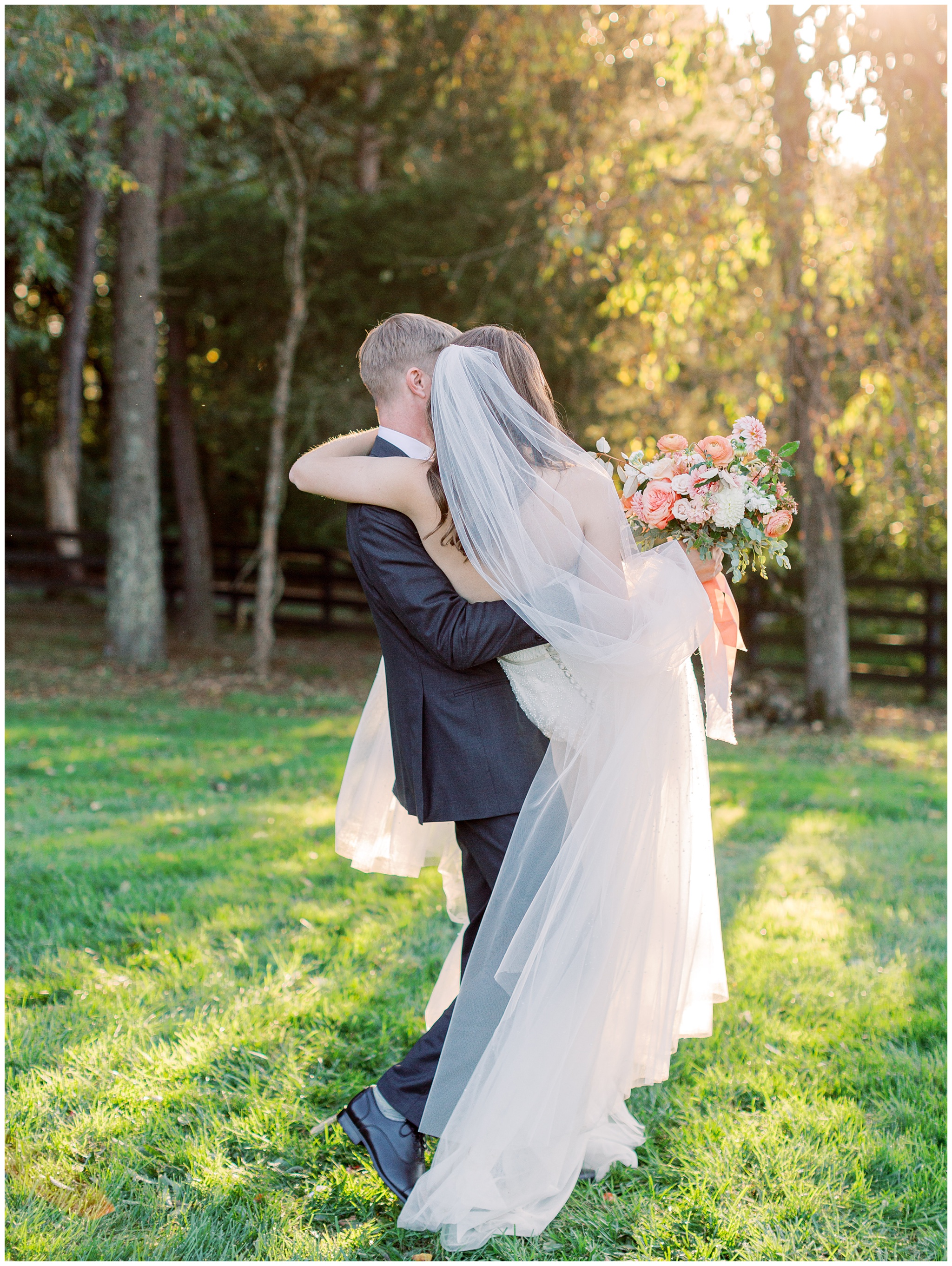 Groom picking bride up