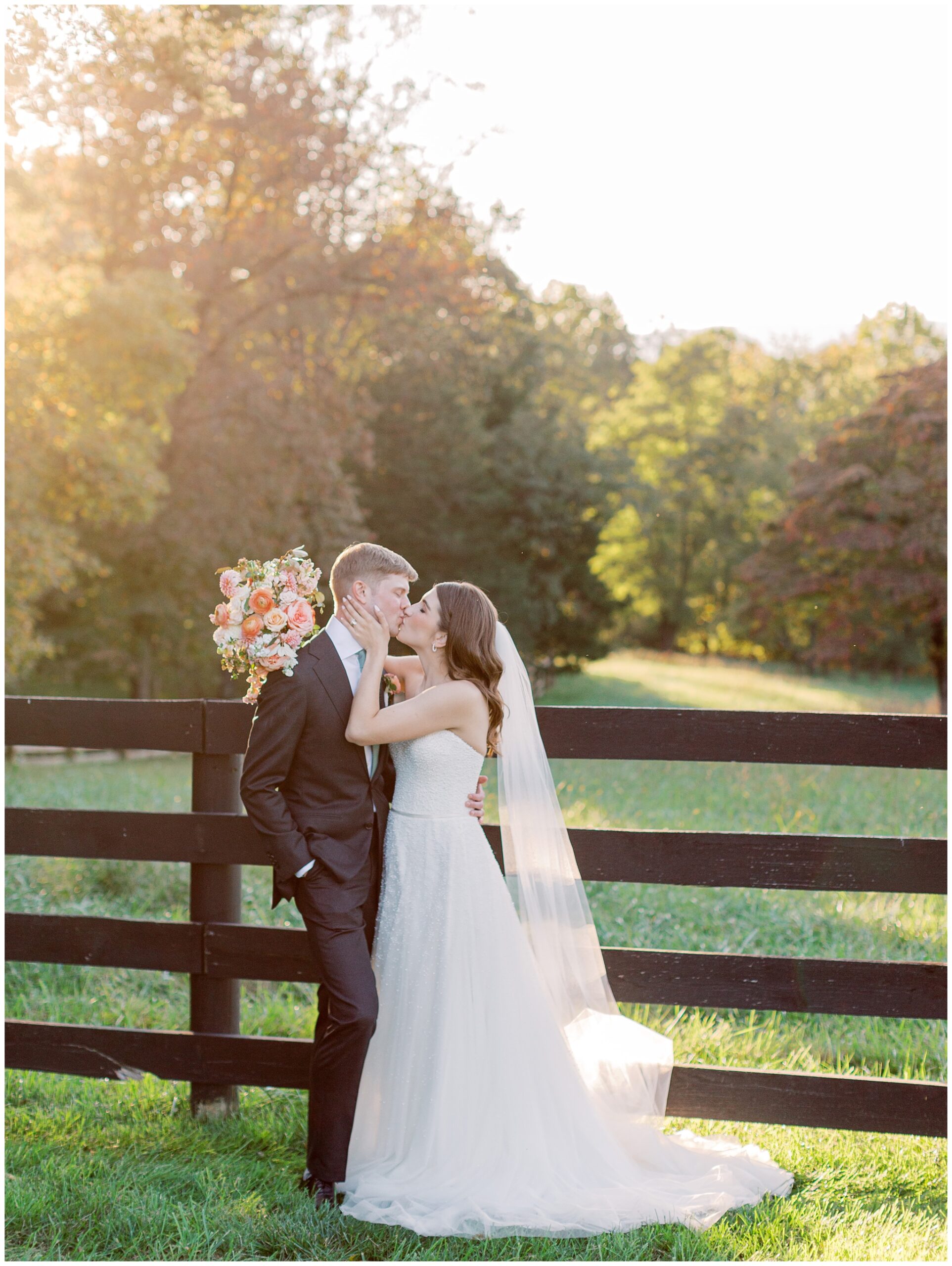 Bride and Groom kissing at Oak Barn at Loyalty wedding