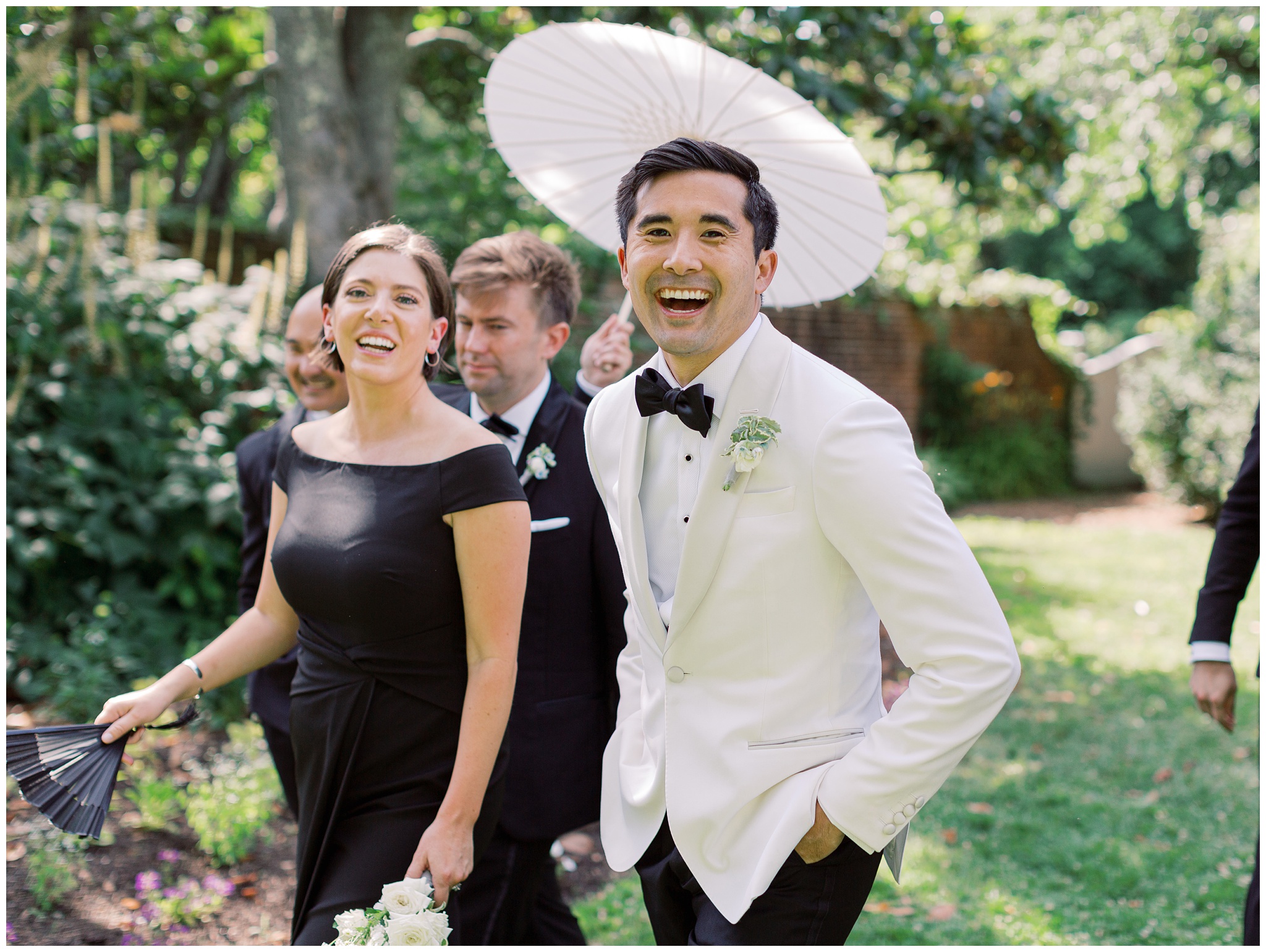 groom walking with wedding party