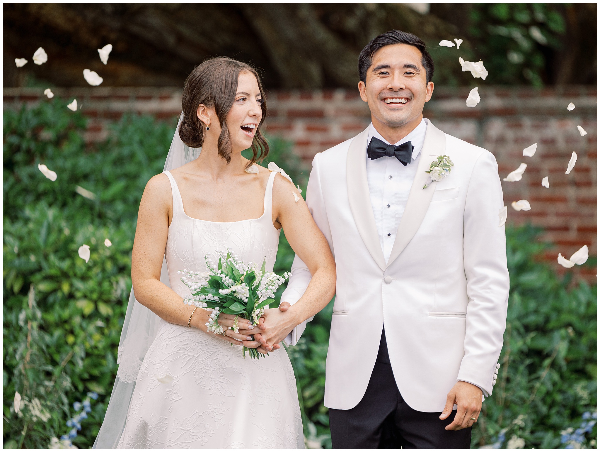 bride and groom with flower petals
