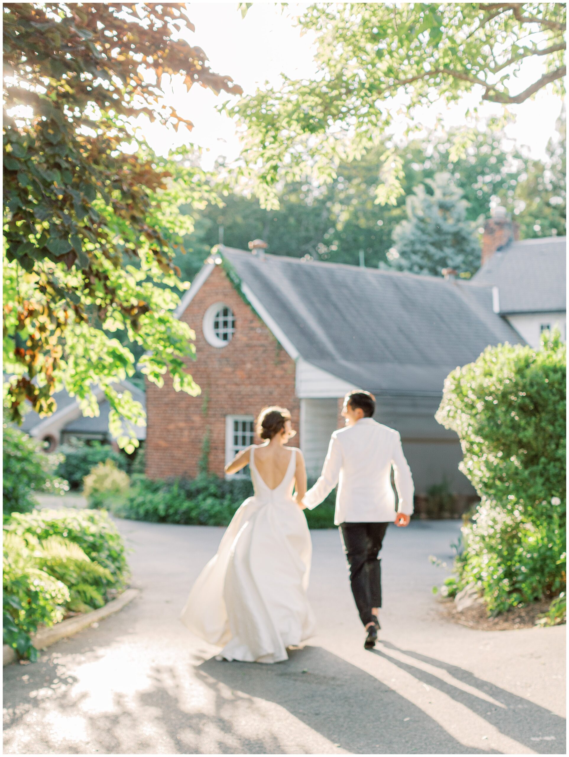 bride and groom running at River Farm wedding