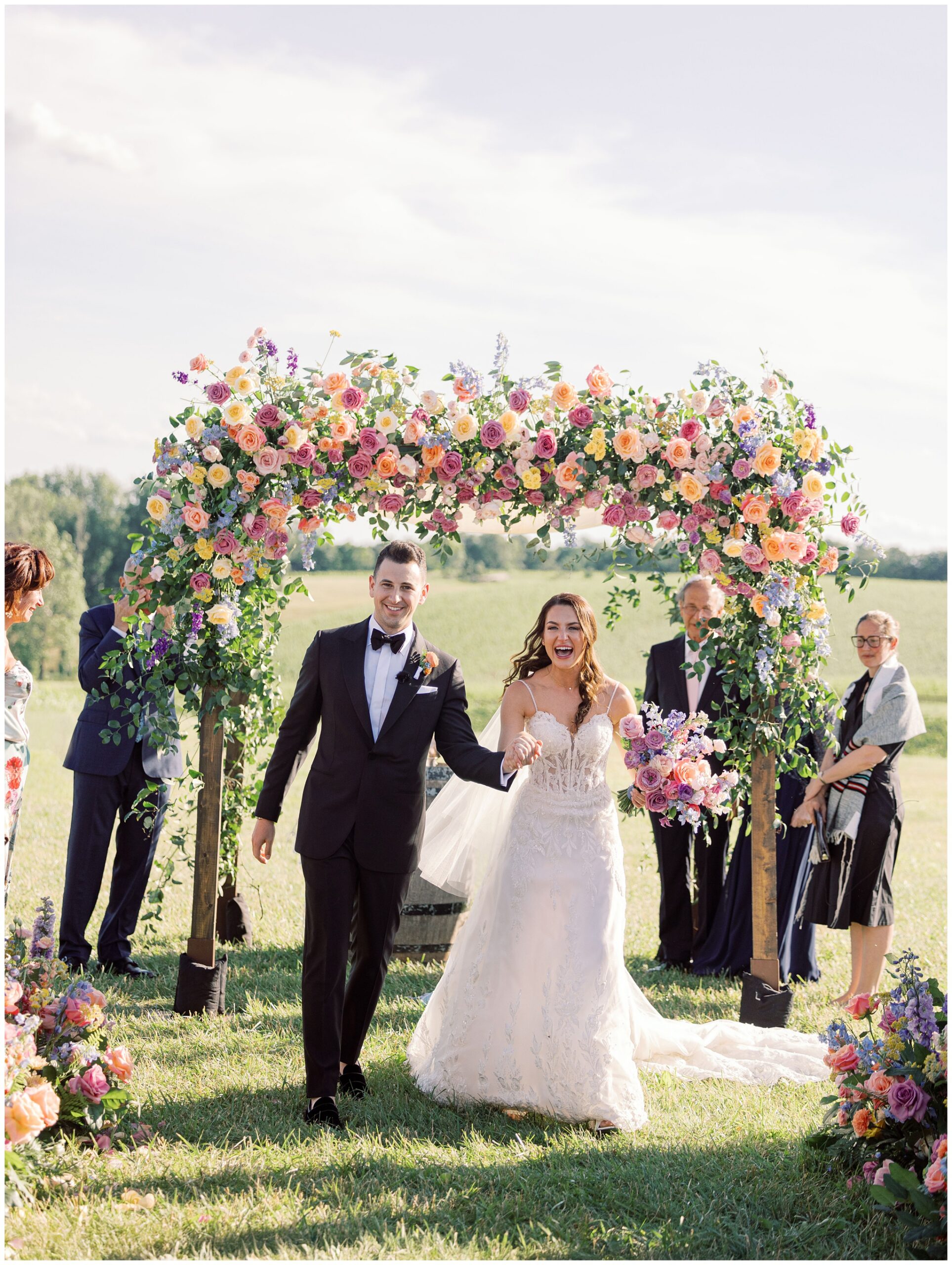 Bride and Groom happily walking down the aisle after Stone Tower Winery wedding ceremony