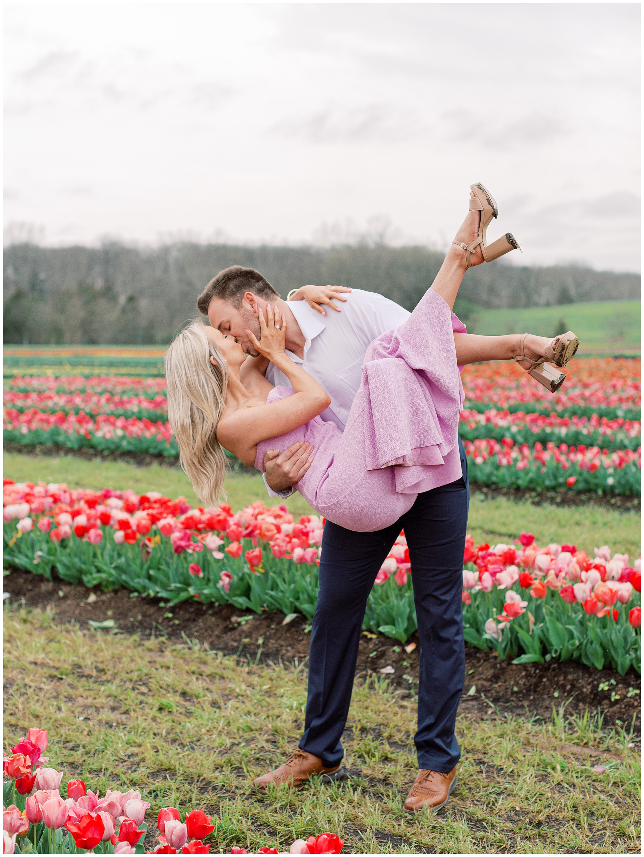 Couple kissing in the tulip fields