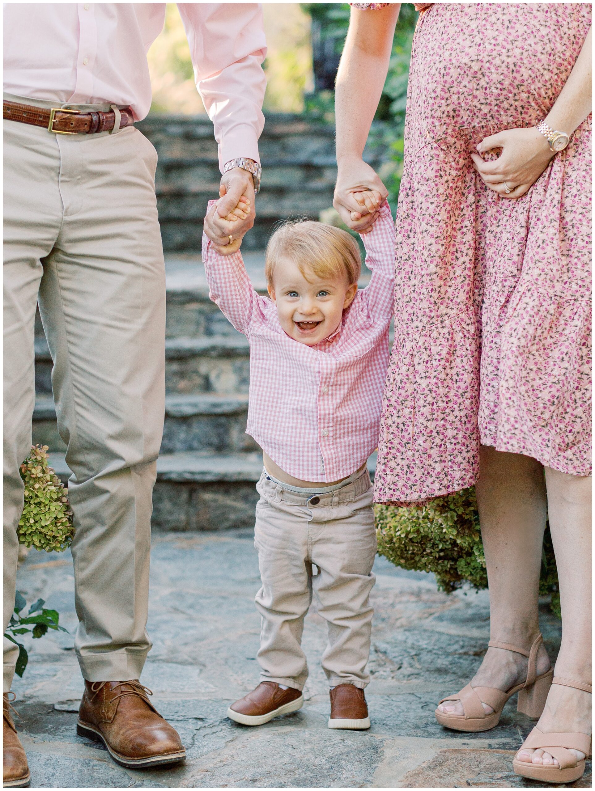 Toddler laughing during family maternity photos on the hydrangea staircase at Bluemont Vineyard