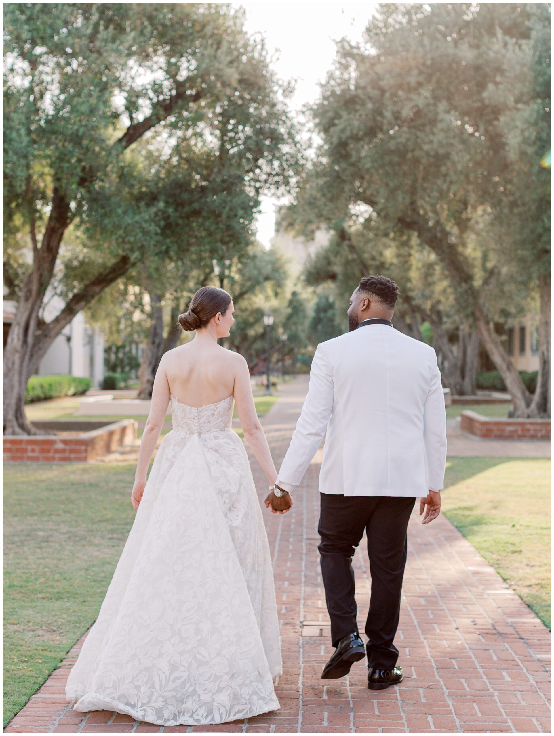 Bride and Groom walking at Caltech Athenaeum wedding
