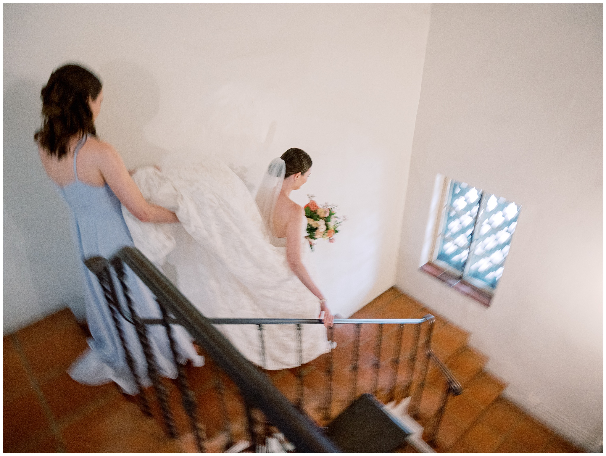 bride walking down steps at Caltech Athenaeum
