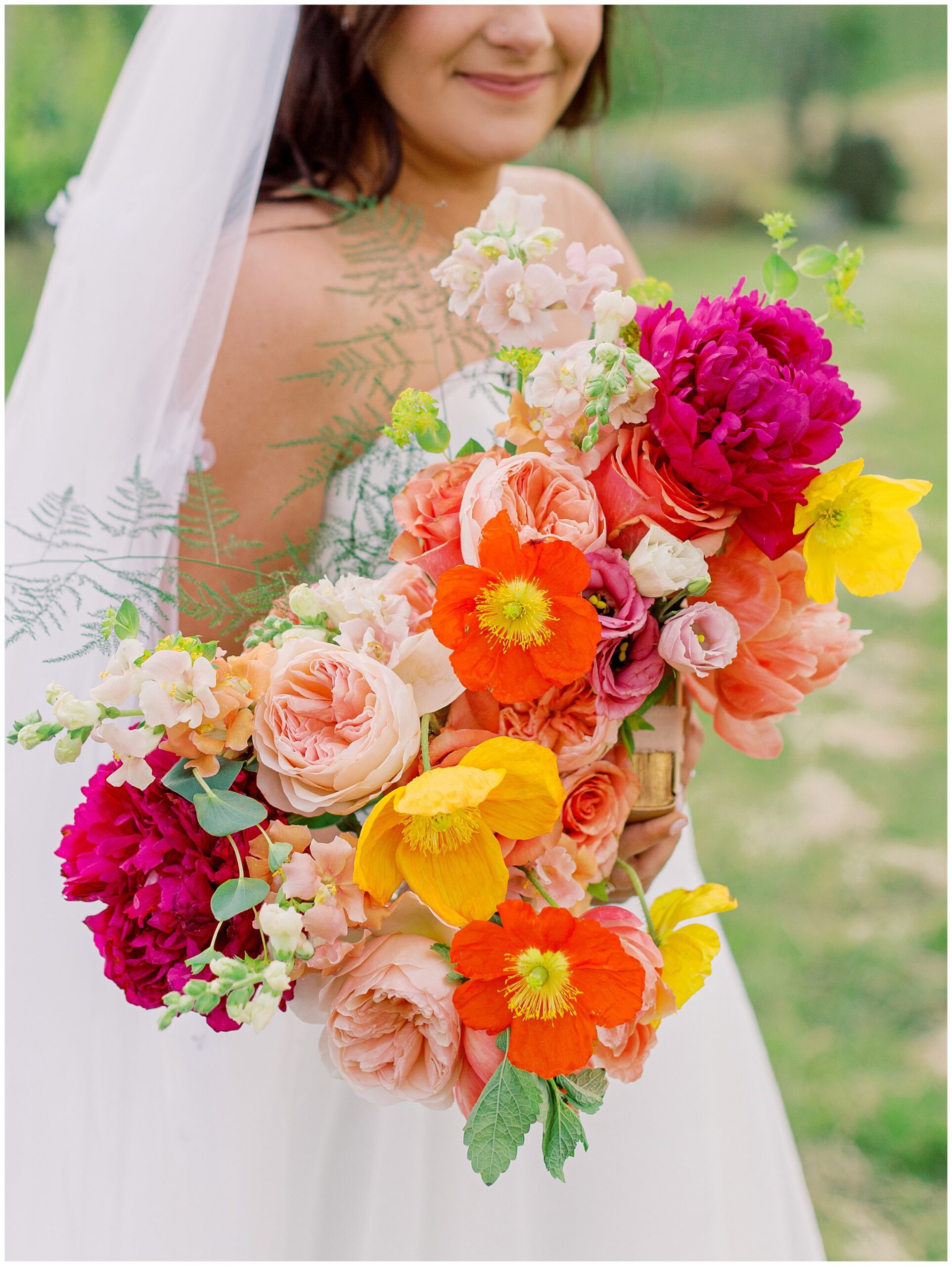 Pink, orange, yellow, and red flowers at Stone Tower Winery wedding