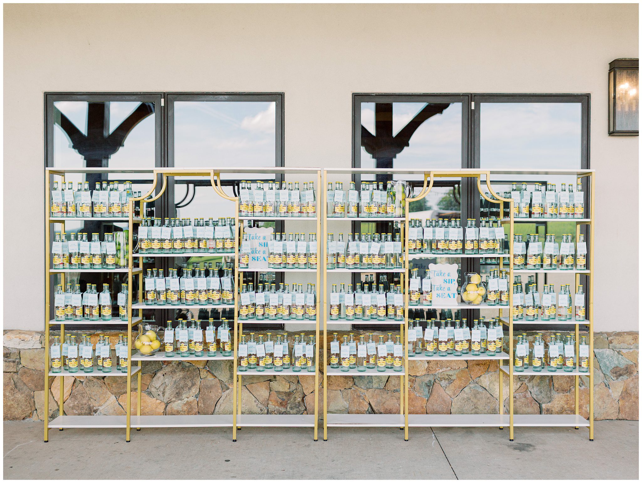 Topo Chico escort card wall at Stone Tower Winery wedding