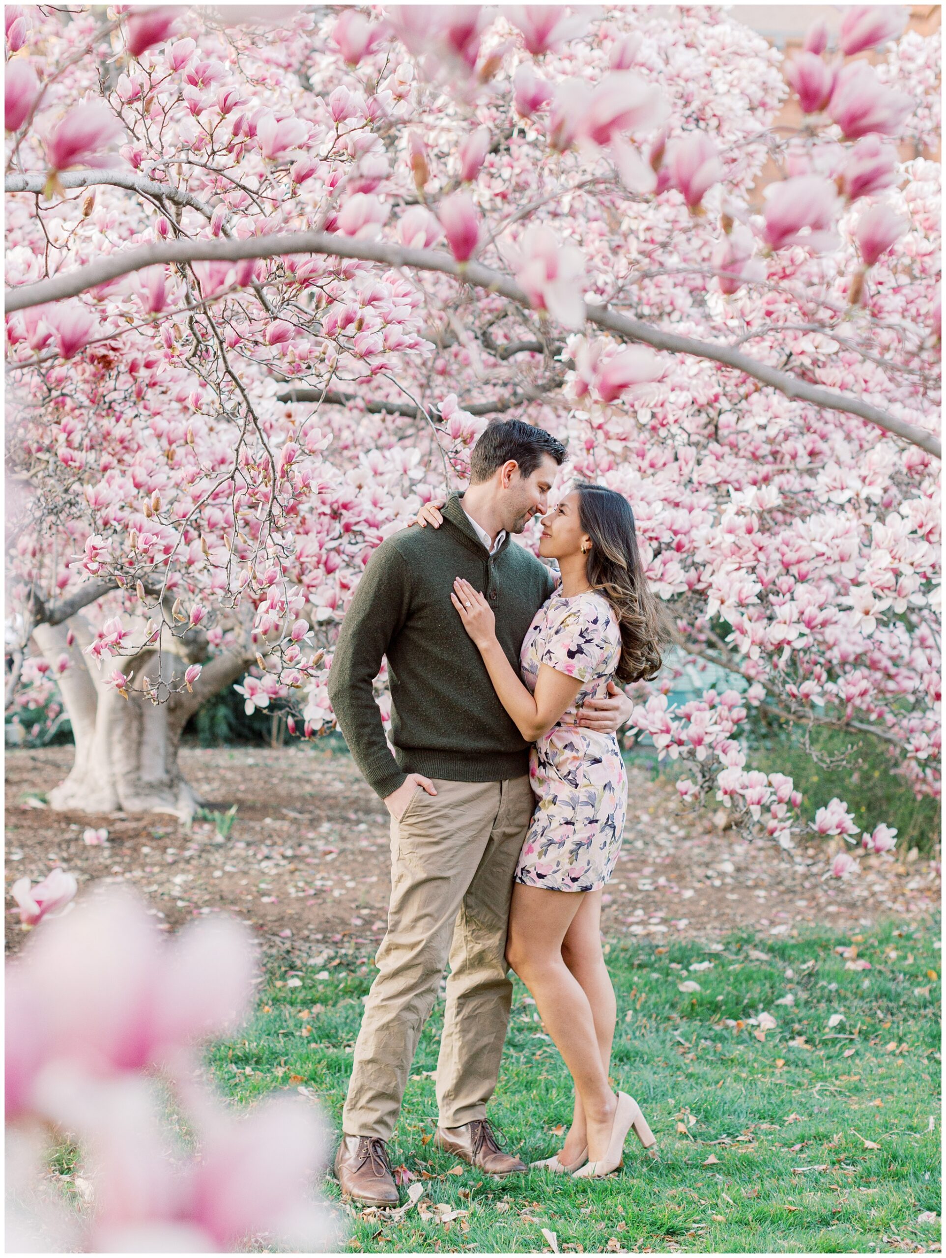 Candid moment of Lynette and Alex enjoying their magnolia engagement session in Washington DC