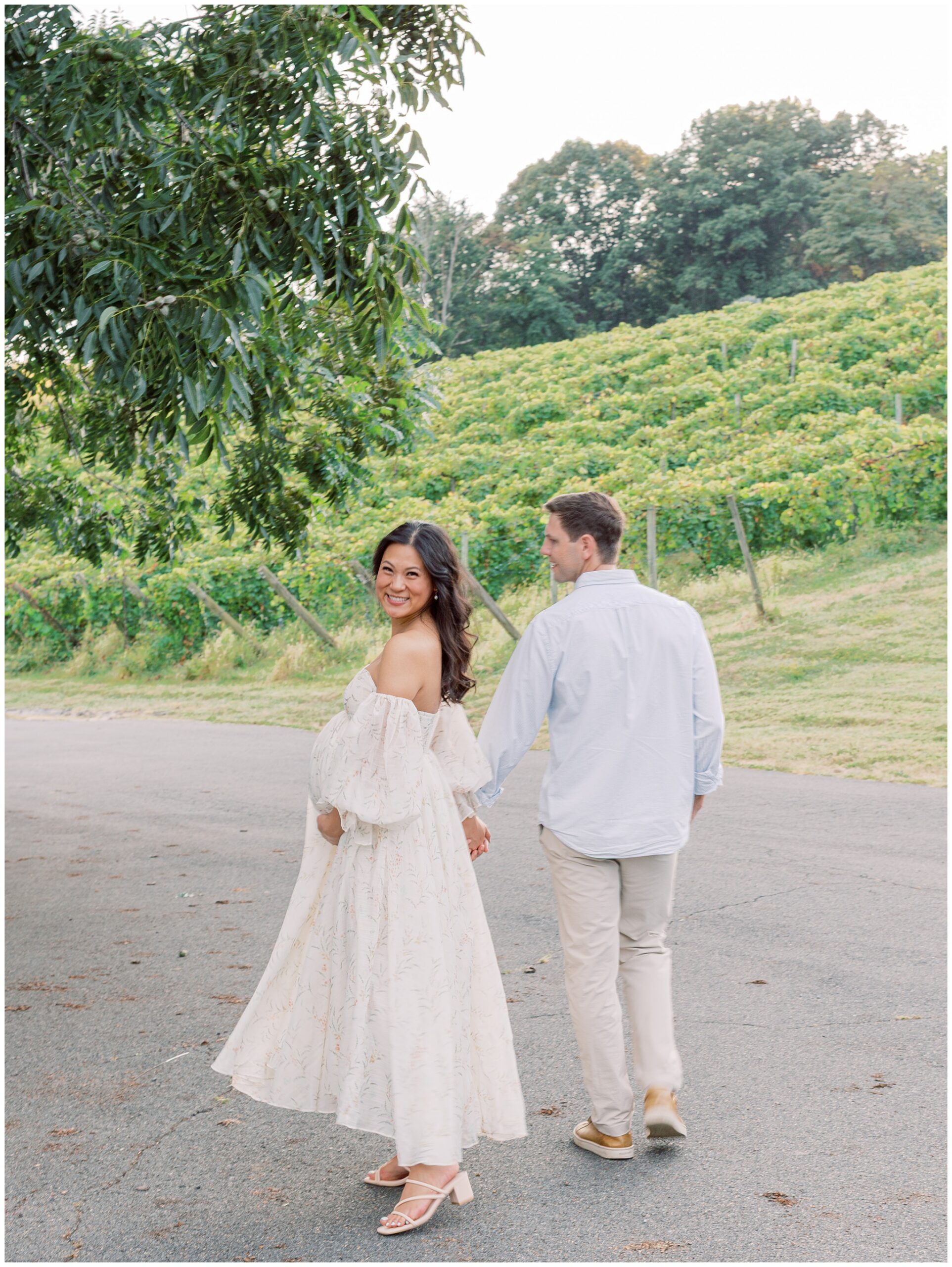 Jenny and Mike walking away towards the vines