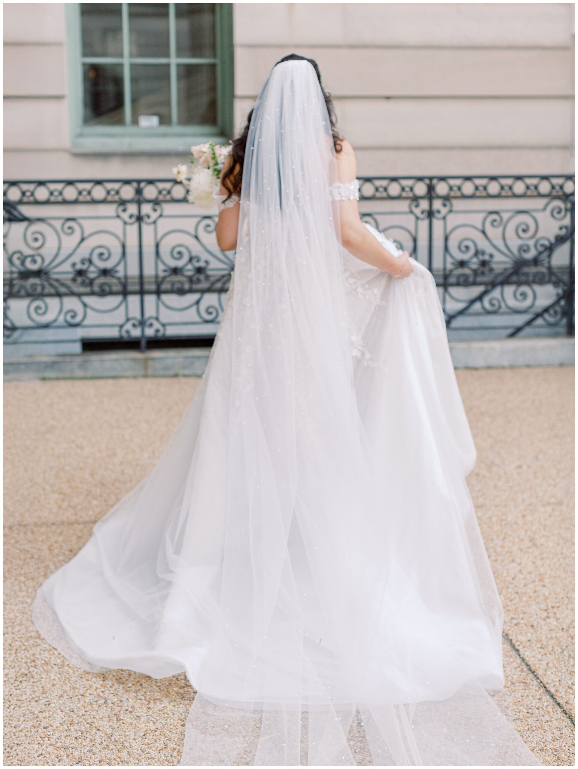 Artsy photo of bride walking away at Larz Anderson House wedding