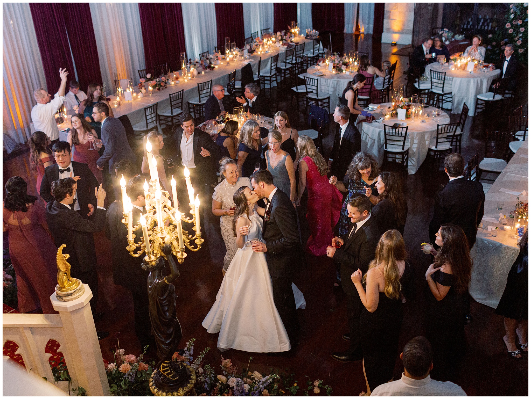 Bride and groom kissing on the dance floor in the Ballroom during their wedding reception