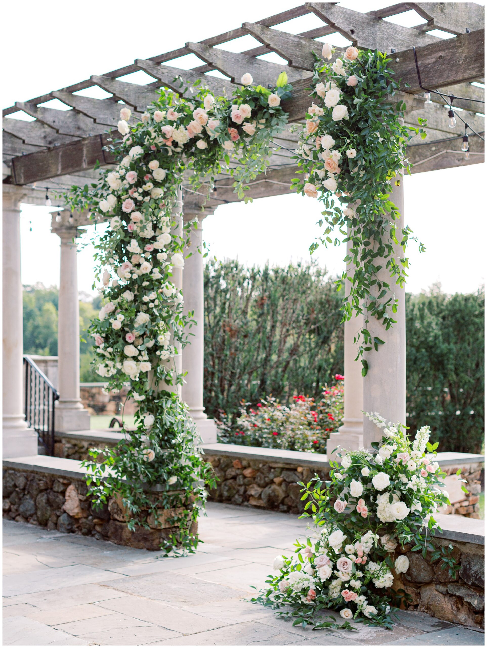 Lush floral ceremony arch on the Bluestone Terrace