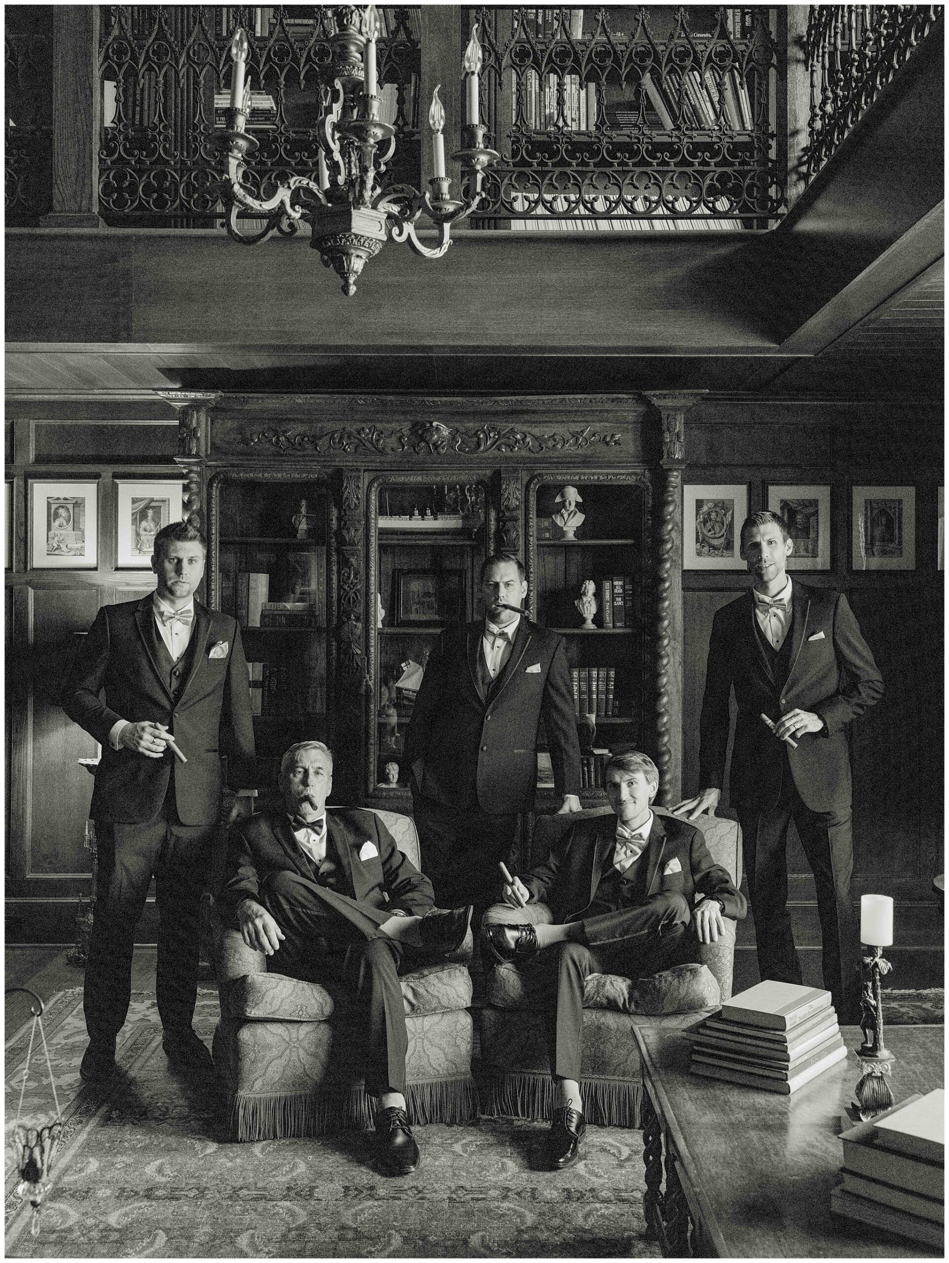 Groom and groomsmen posing for a fashion-inspired portrait in the Library