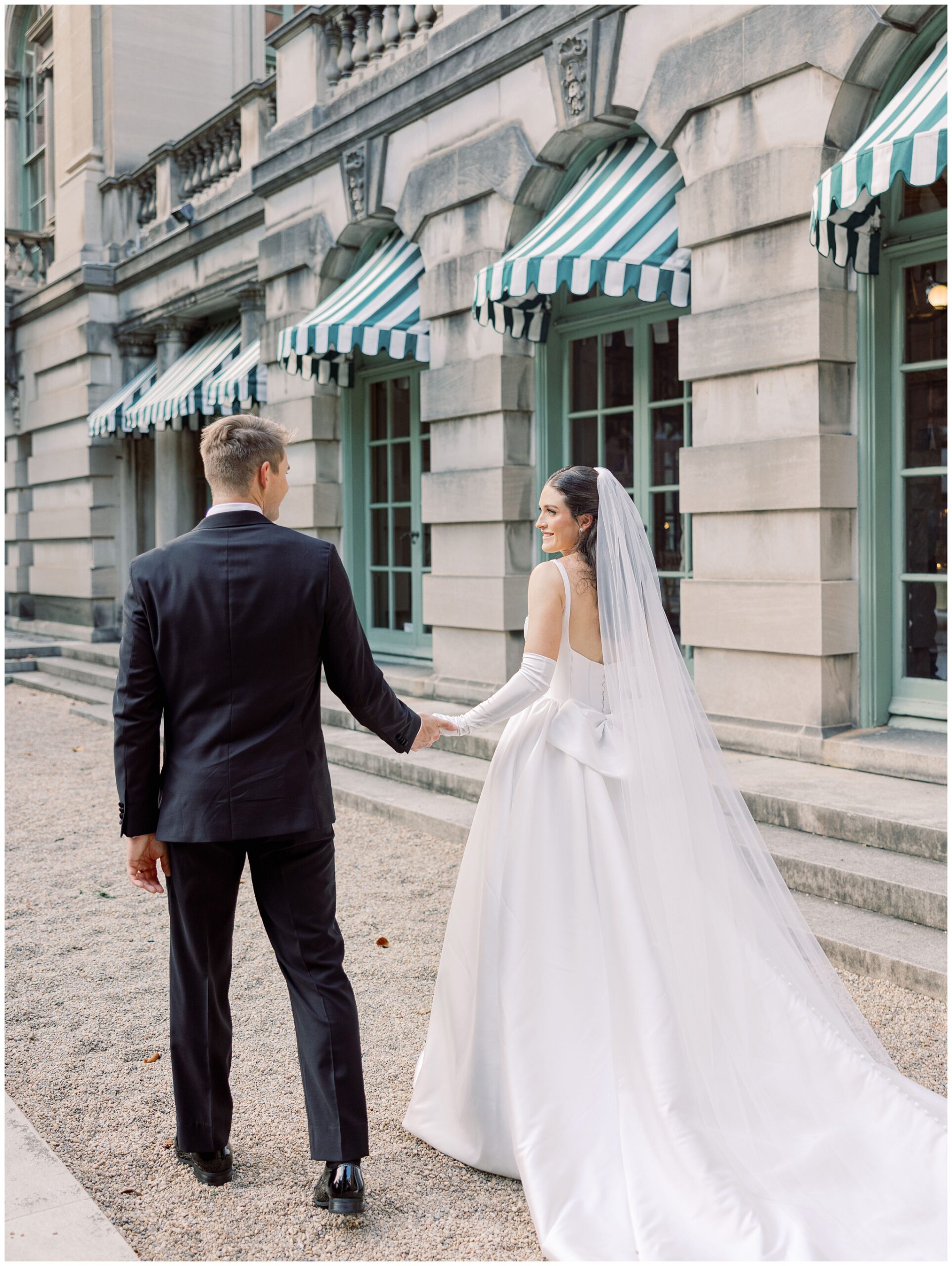 Newlywed couple walking through Hoyt Garden at Larz Anderson House wedding