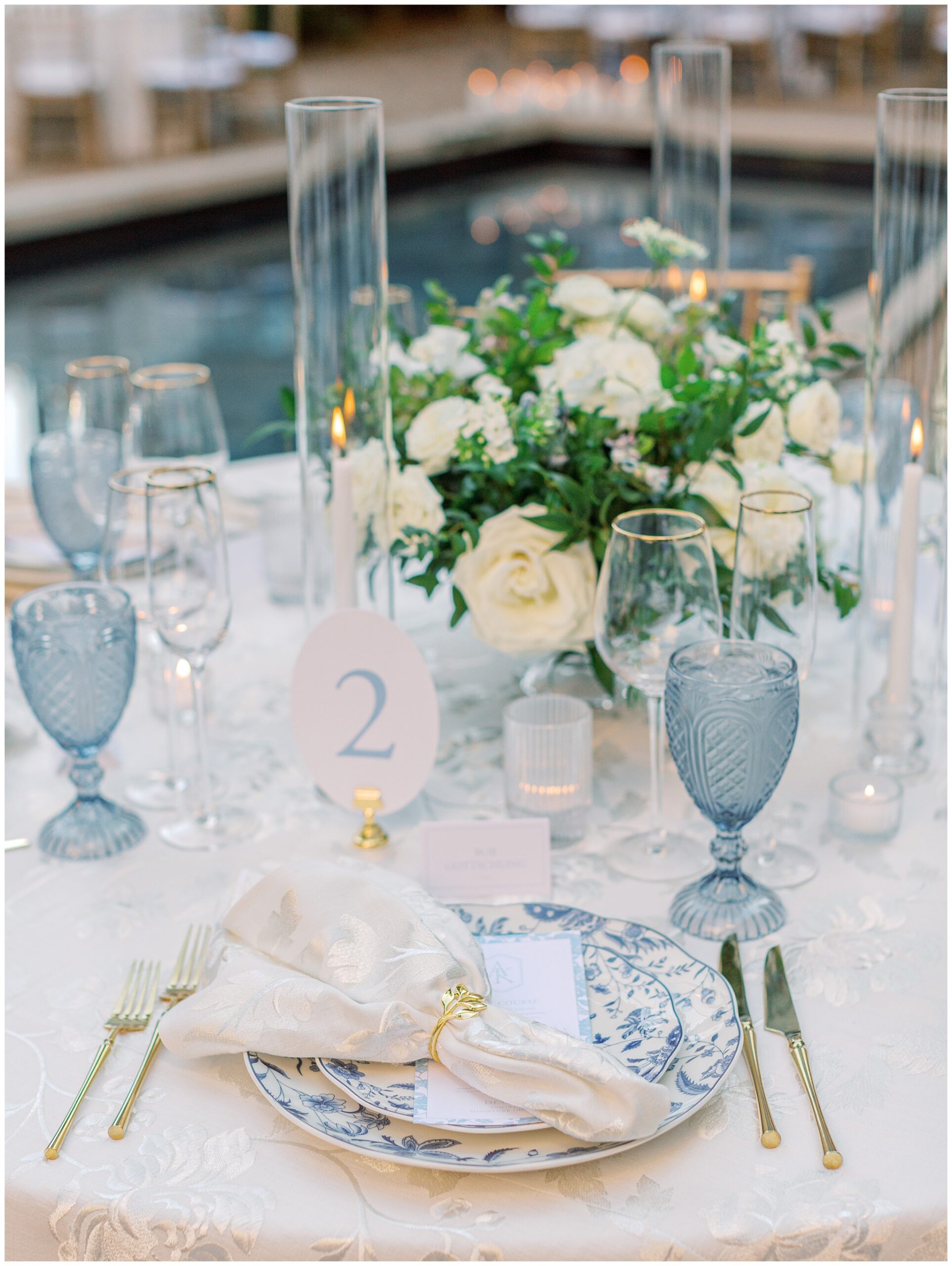 Blue and white place setting with elegant table details