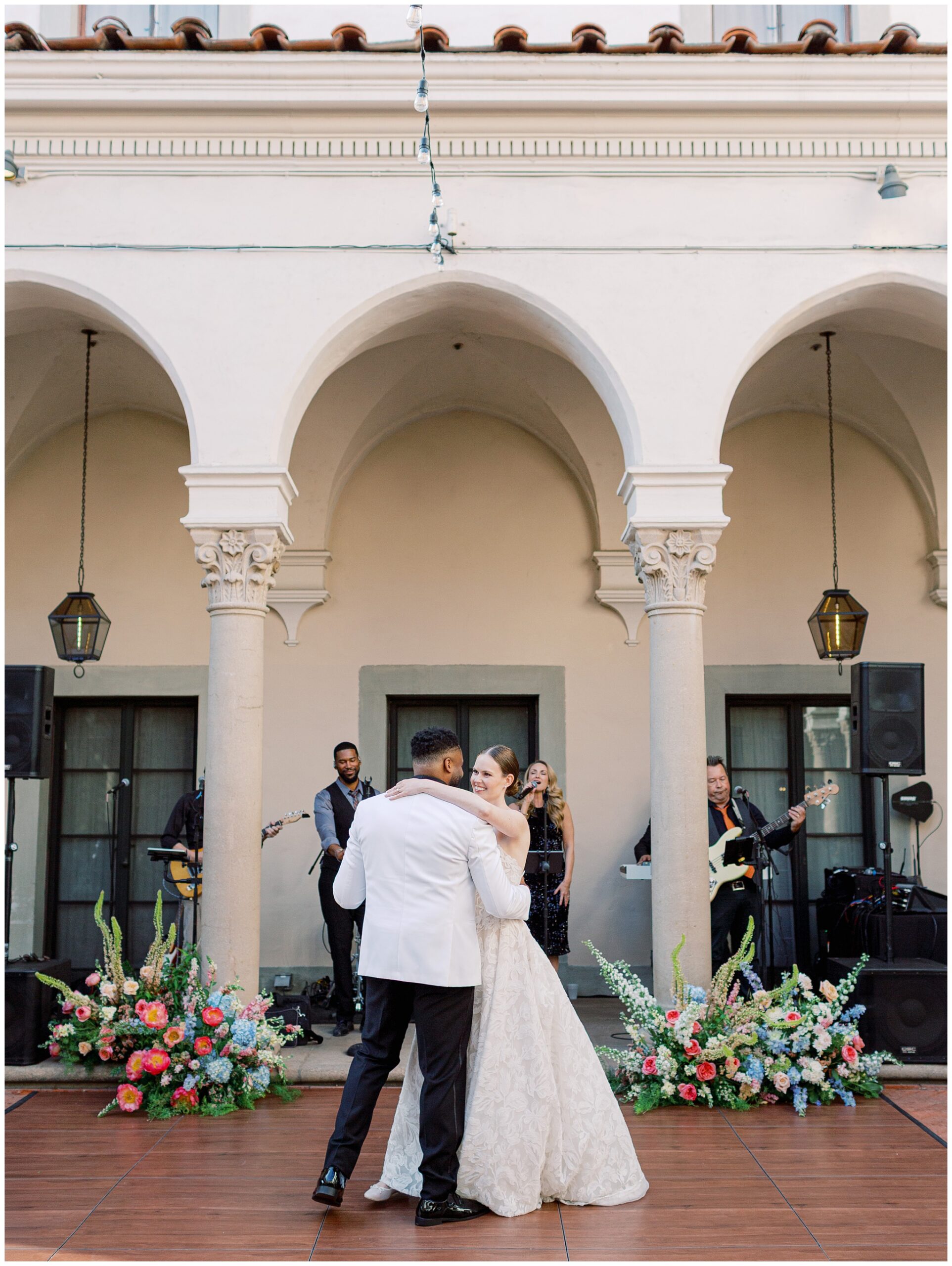 Bride and groom dancing on the West Patio at the Caltech Athenaeum during their wedding reception